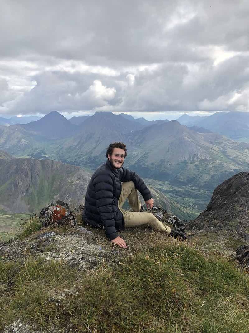 author on a mountain in summer